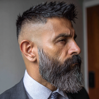 Modern full beard style with clean lines and structured grooming for professional men
